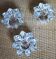 A set of 3 vintage star flower glass candle holders.