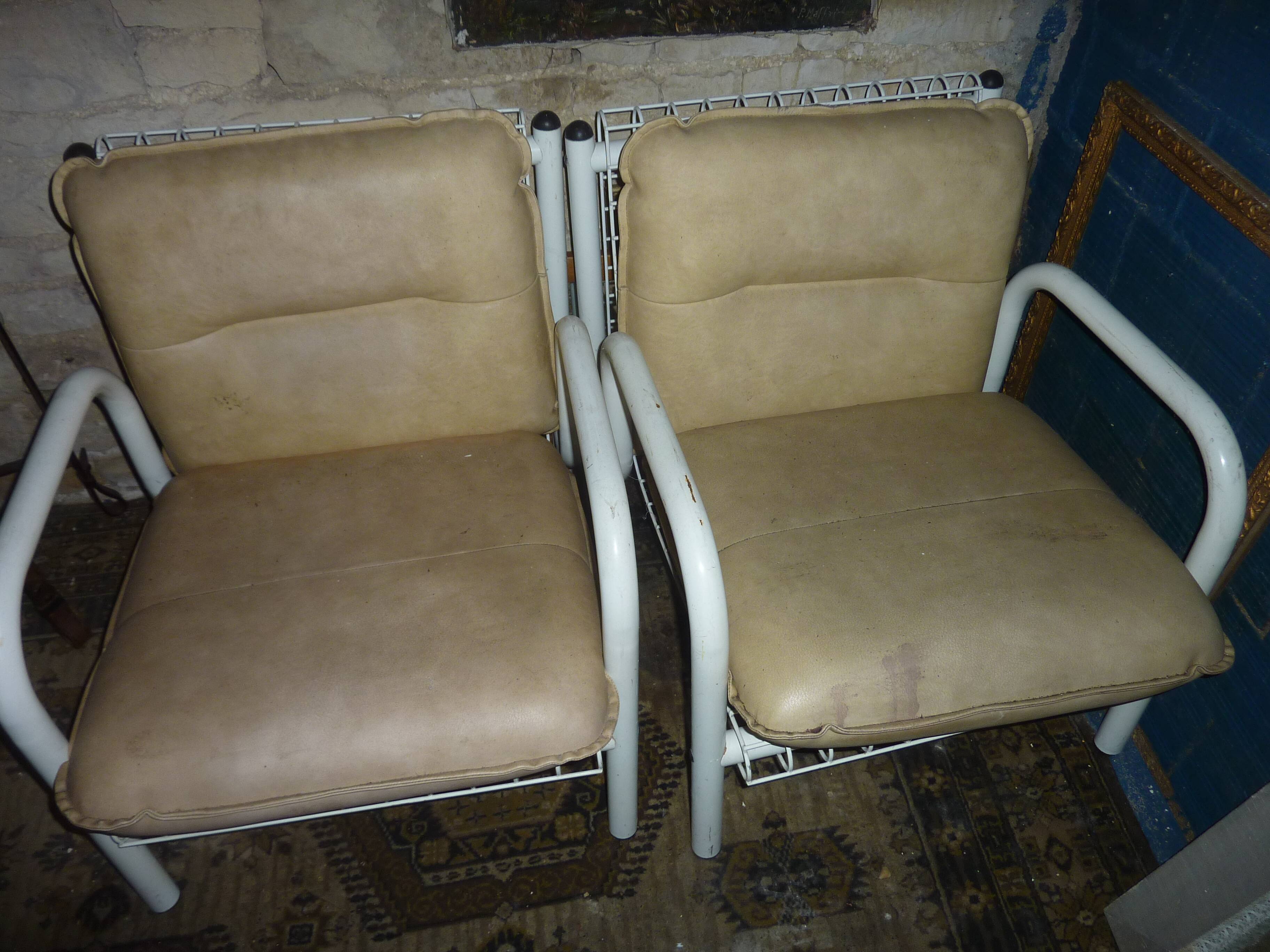 pair of iron armchairs