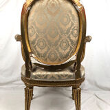 Carved and gilded wooden armchair in Louis XVI style, circa 1900