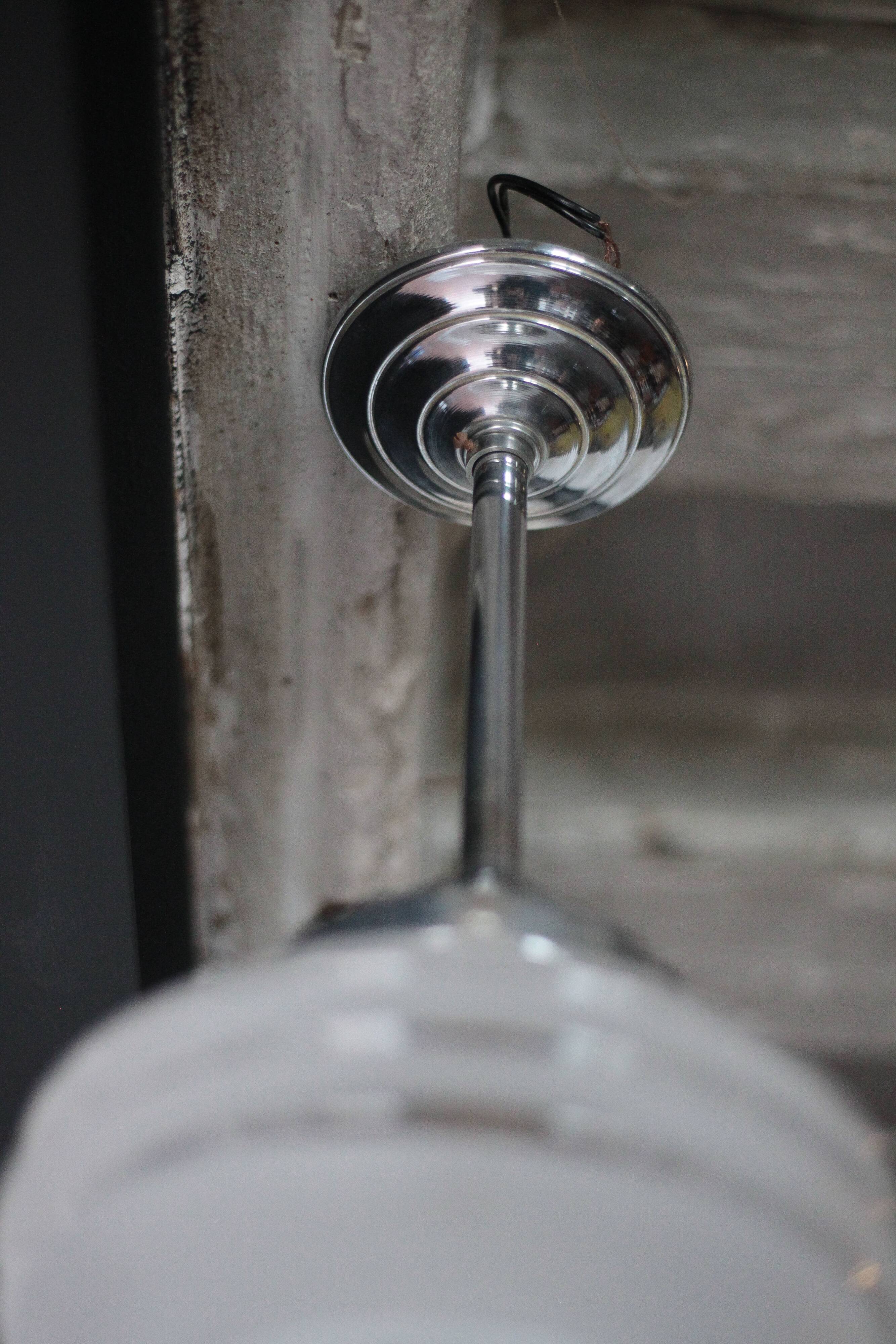 Art Deco pendant light, chrome metal suspension and glass globe, ceiling lamp.