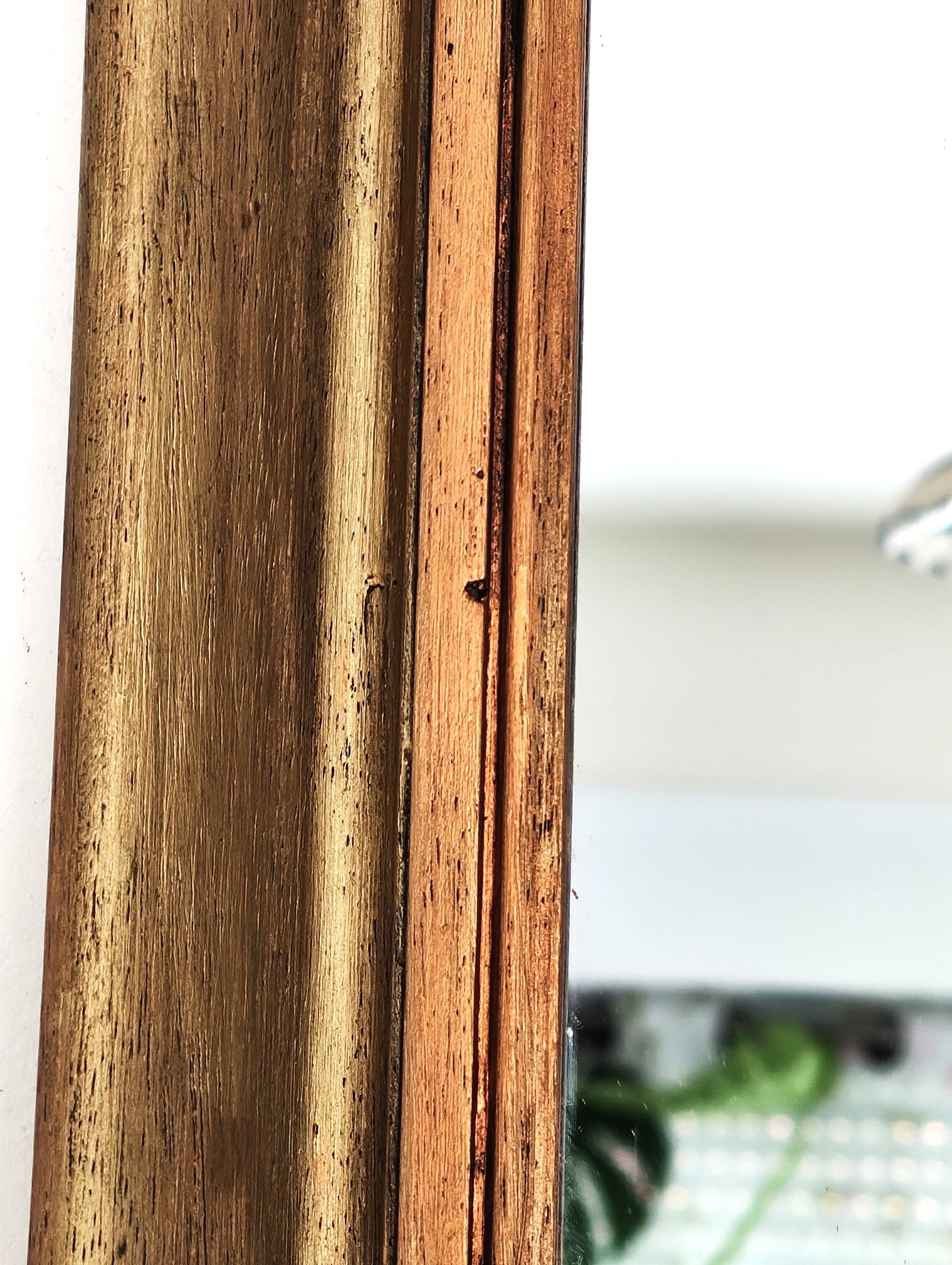 Antique mirror in gilded and copper wood