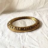 Small vintage wall mirror in gold resin