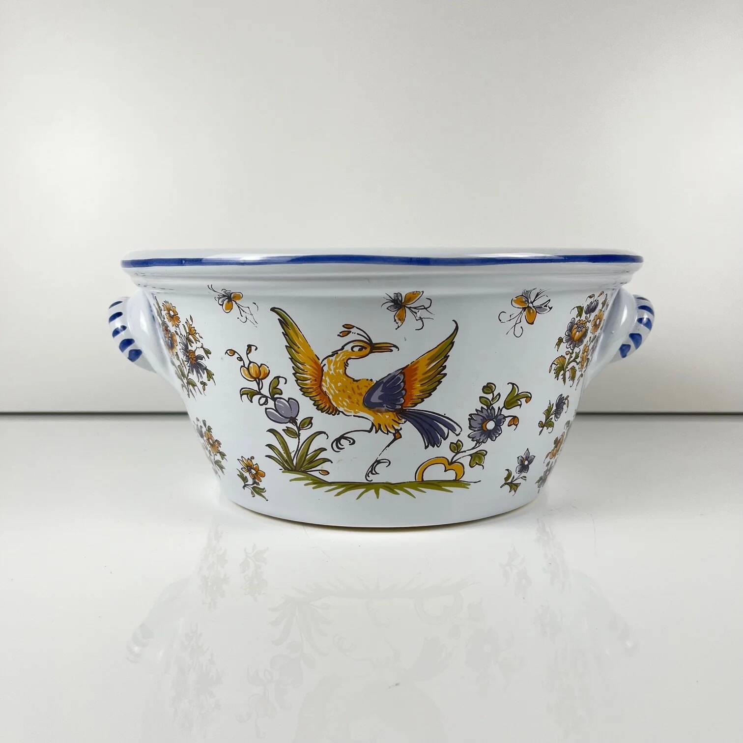 Large hand-painted earthenware salad bowl, signed "Mousiters", 20th century.