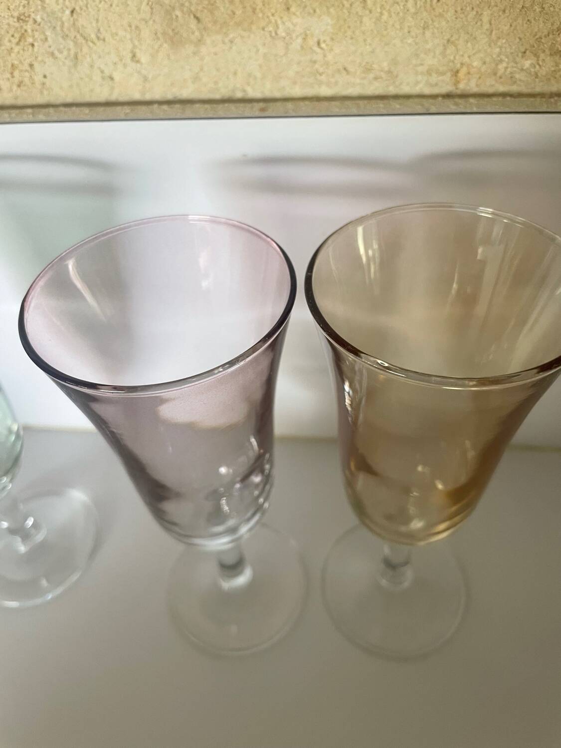 3 iridescent colored champagne glasses