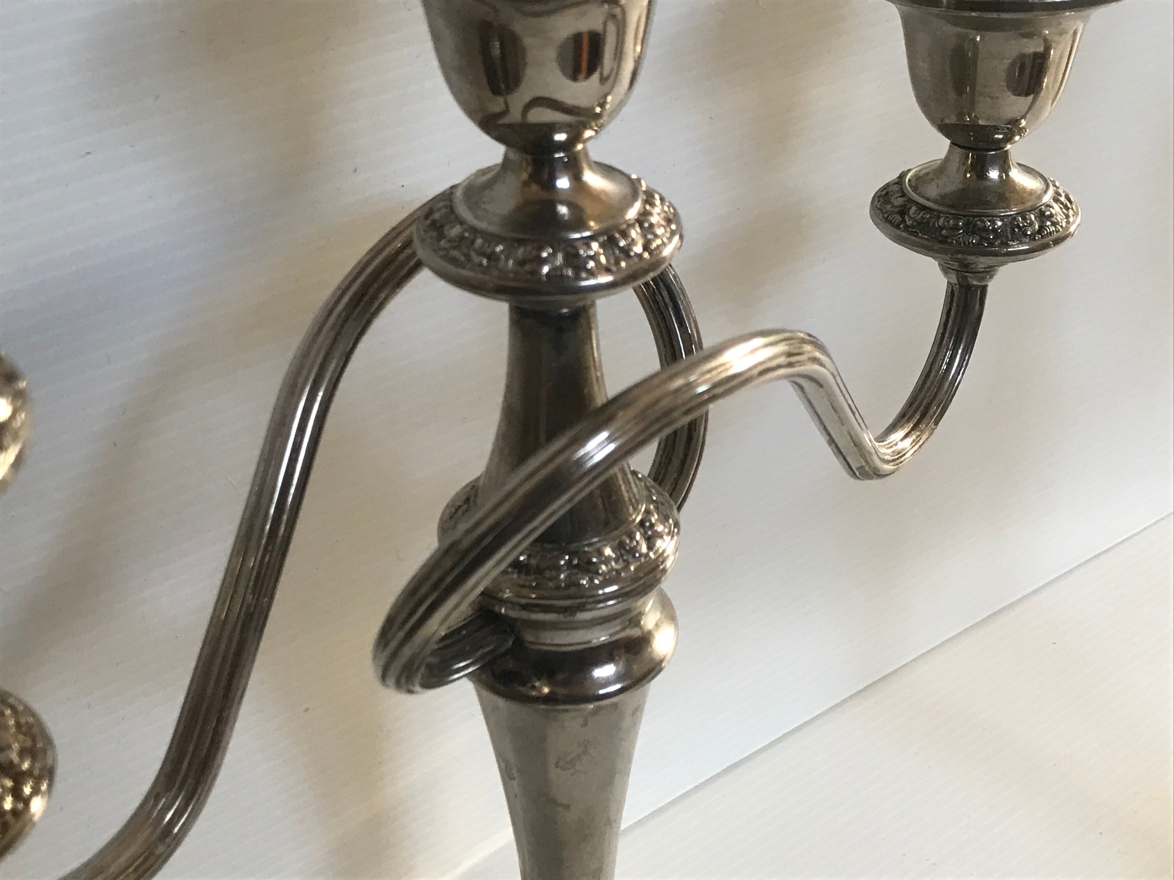 Pair of silver metal chandeliers