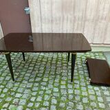 Scandinavian extendable dining table made of solid wood and rosewood effect.