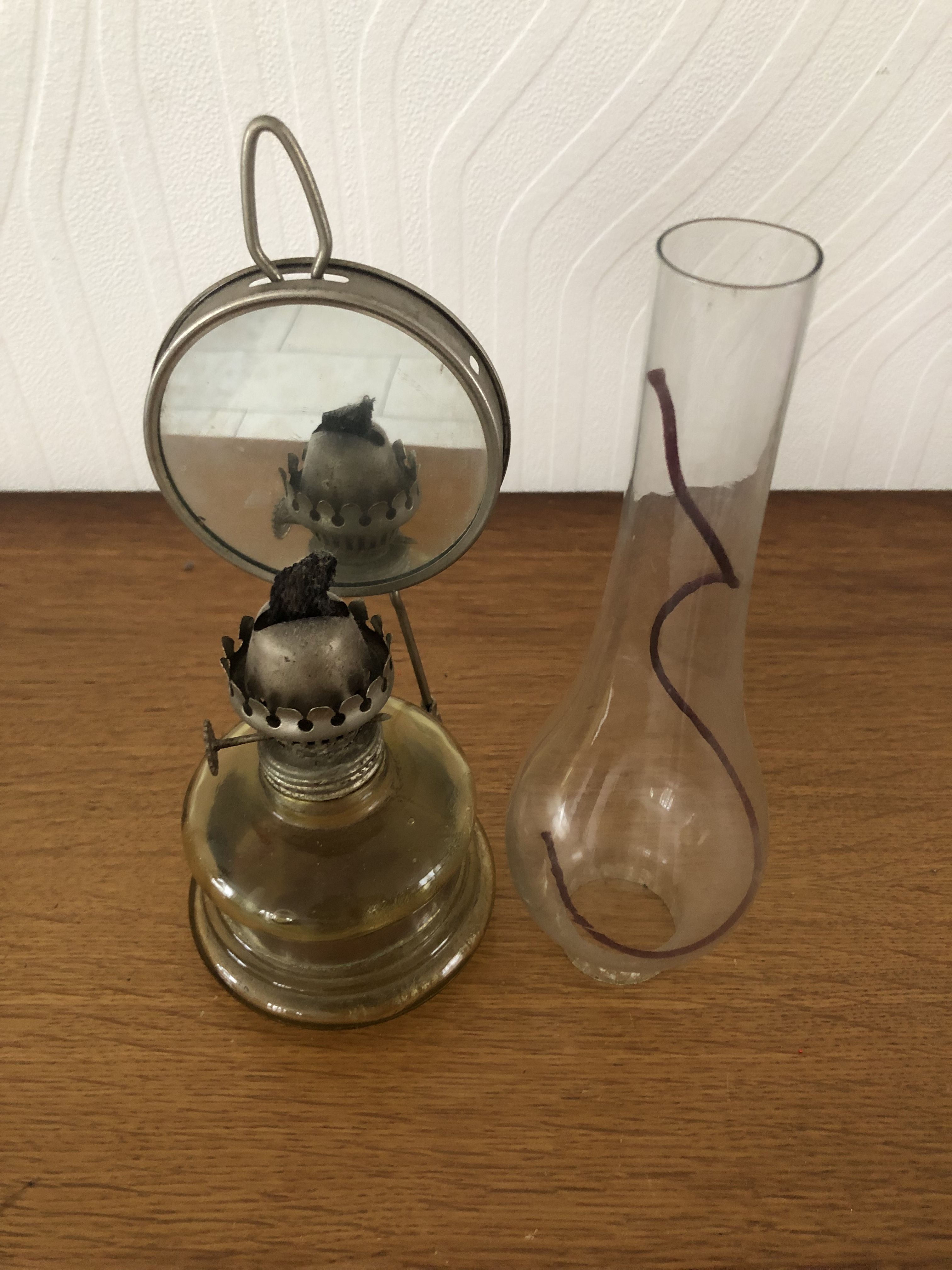 Oil lamp with glass pedestal and integrated round mirror