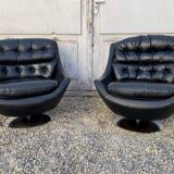 Paire de fauteuils vintage pivotants en cuir noir pied tulipe