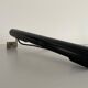 Minimalist black metal wall light with a cylindrical design, 1960s, Germany.
