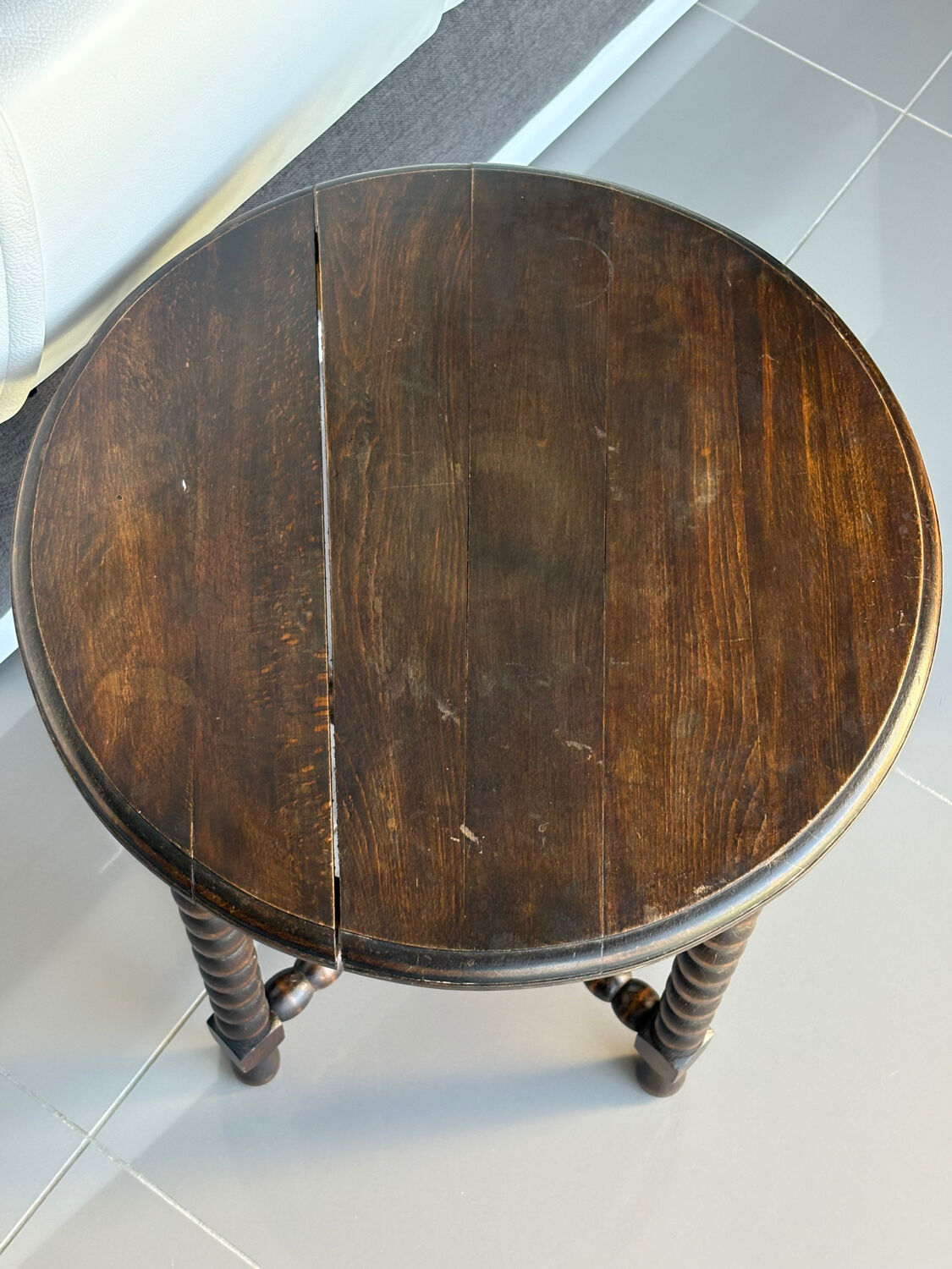 Antique turned wooden side table with authentic charm.