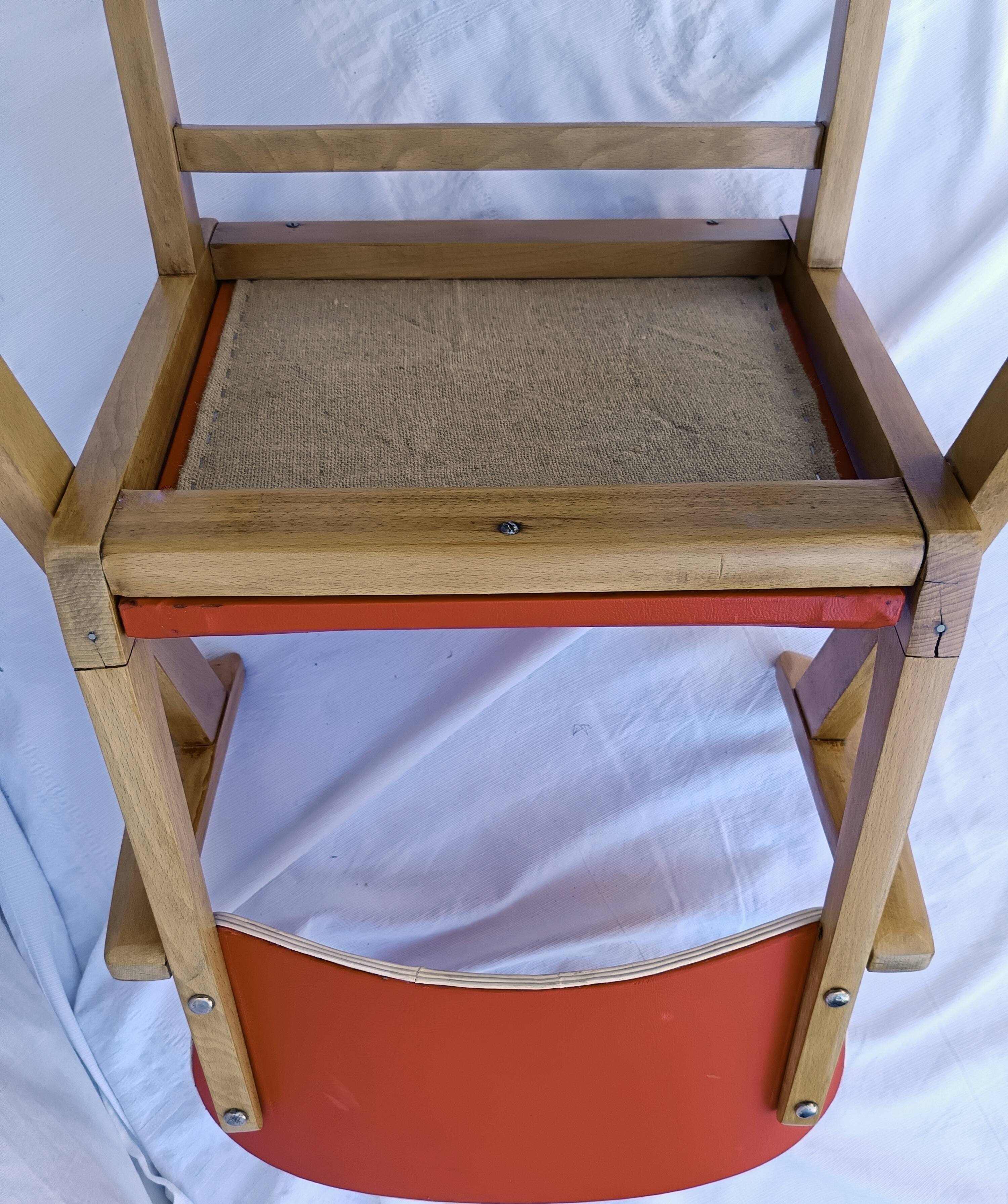 1960s wooden chair with armrests and faux leather seat