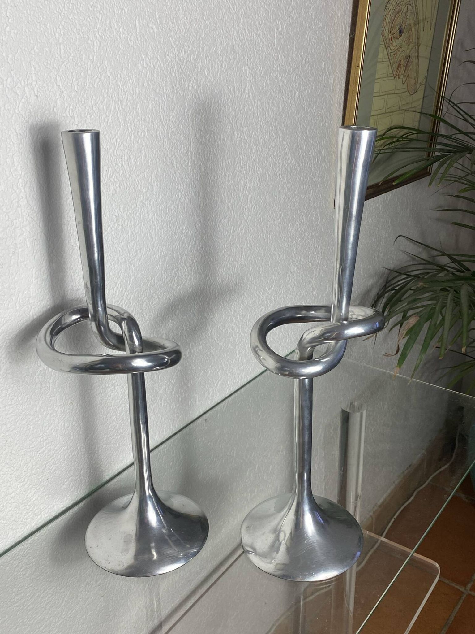Pair of large aluminium bow candlesticks, Italy, 1970.