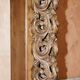 Antique fireplace from around 1880 in solid hand-carved elm with openwork columns.