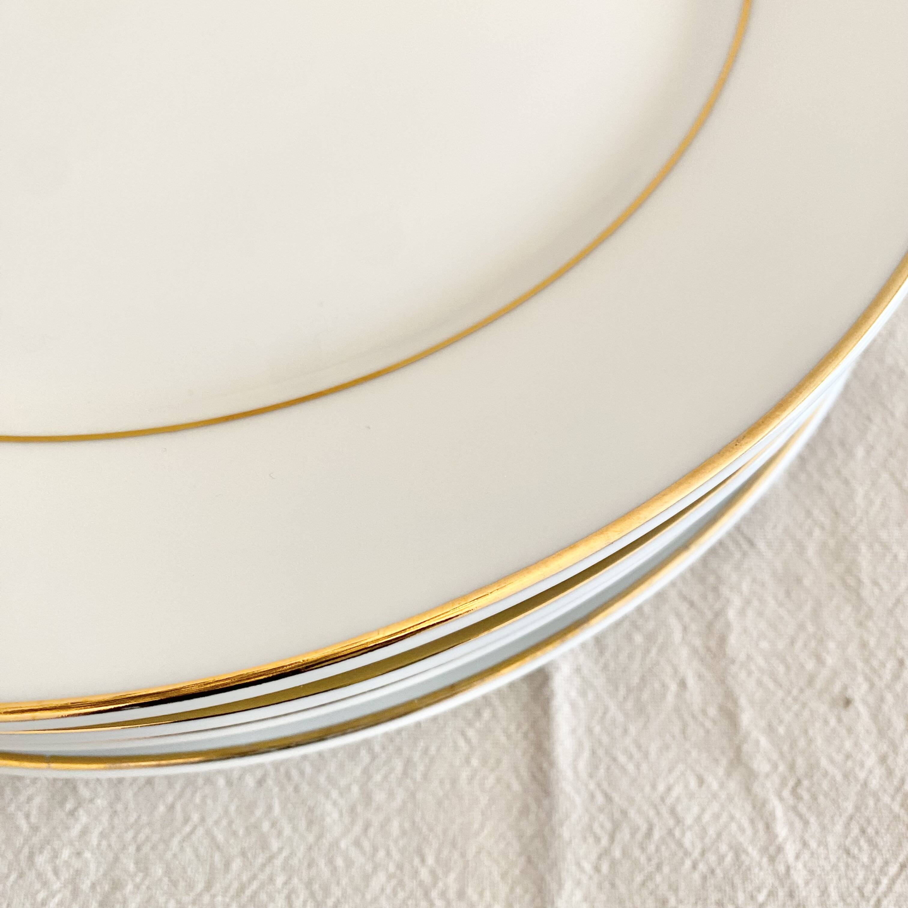 White and gold porcelain dinner plates