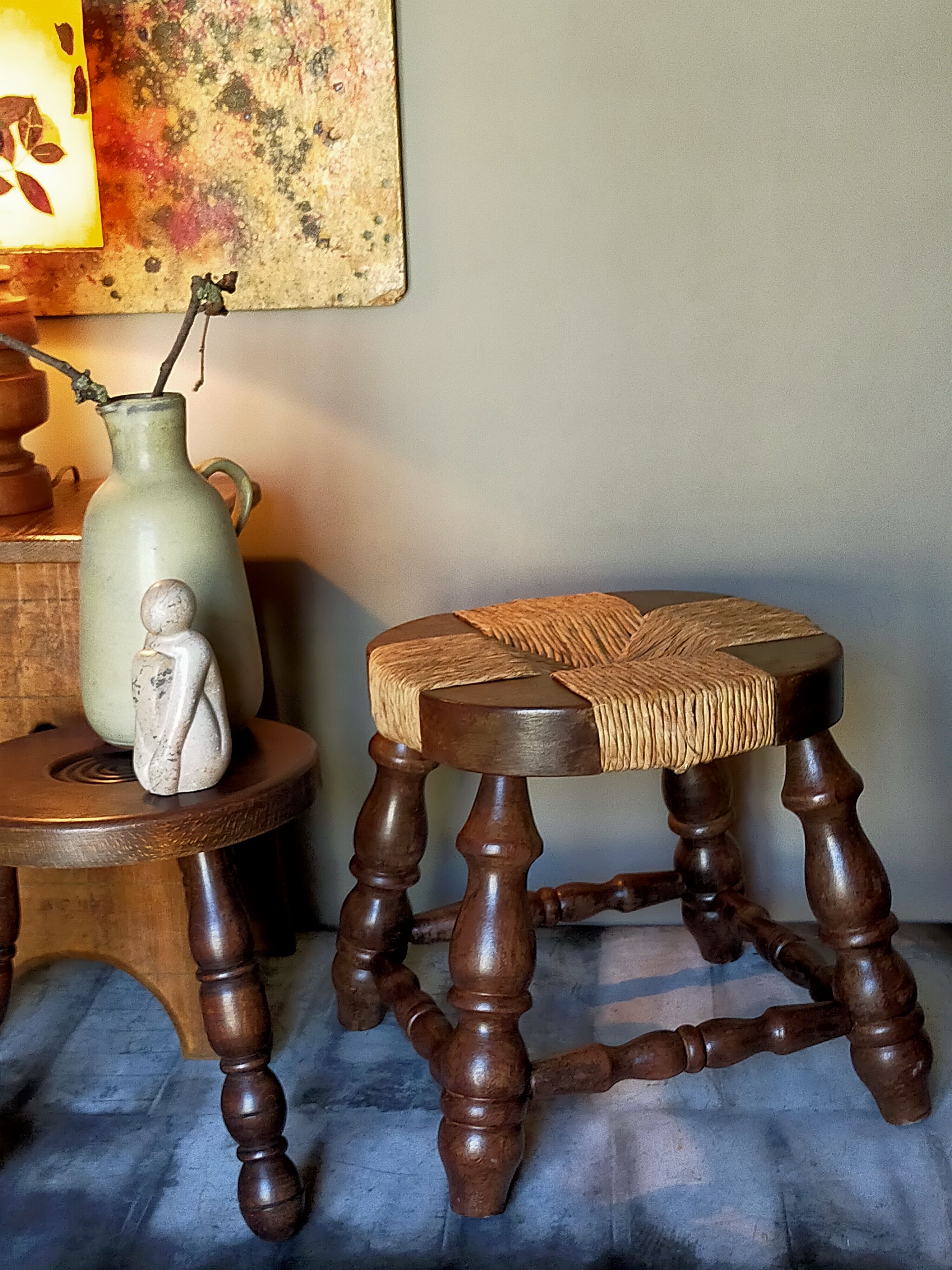 Low vintage regional stool in solid wood with straw top