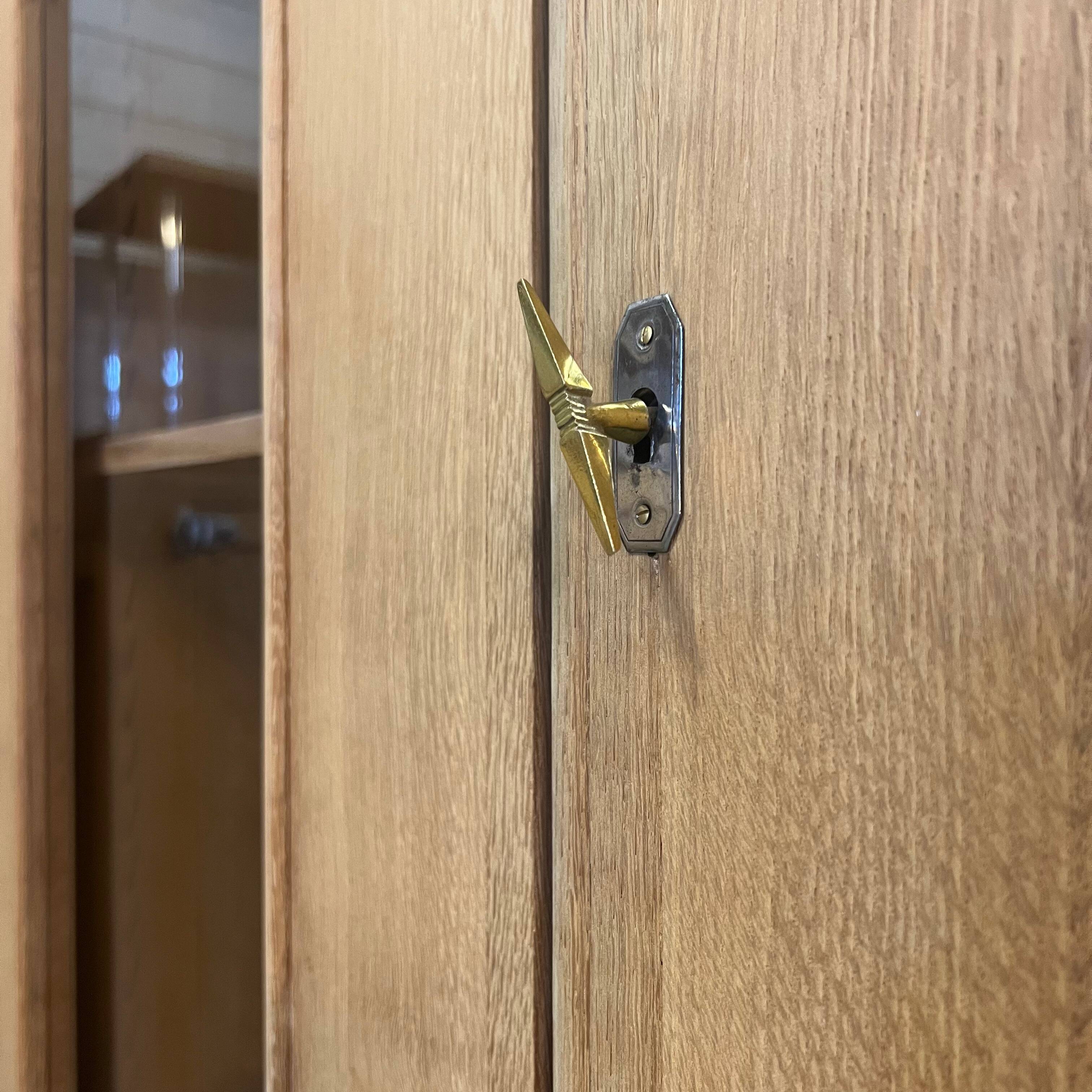 Glass-fronted school cabinet in raw oak