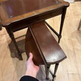 Classic nesting tables in wood and leather.
