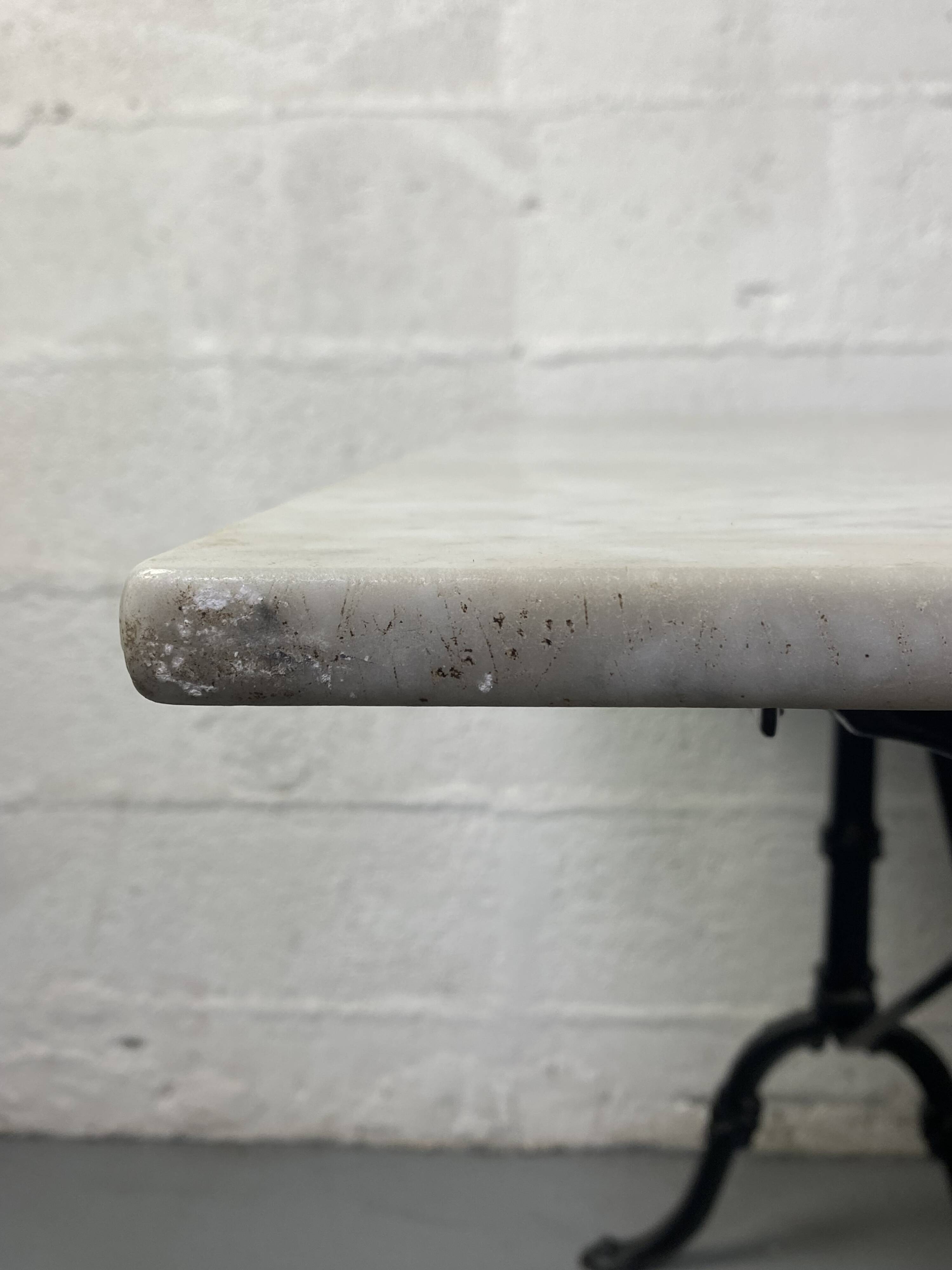 Set of two bistro tables in marble and wrought iron