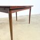 Rosewood dining table with integrated extensions — Denmark, 1960s