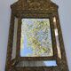 Miroir à parecloses en bois doré et métal repoussé