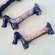 Set of 8 vintage ceramic knife rests, retro dog design.