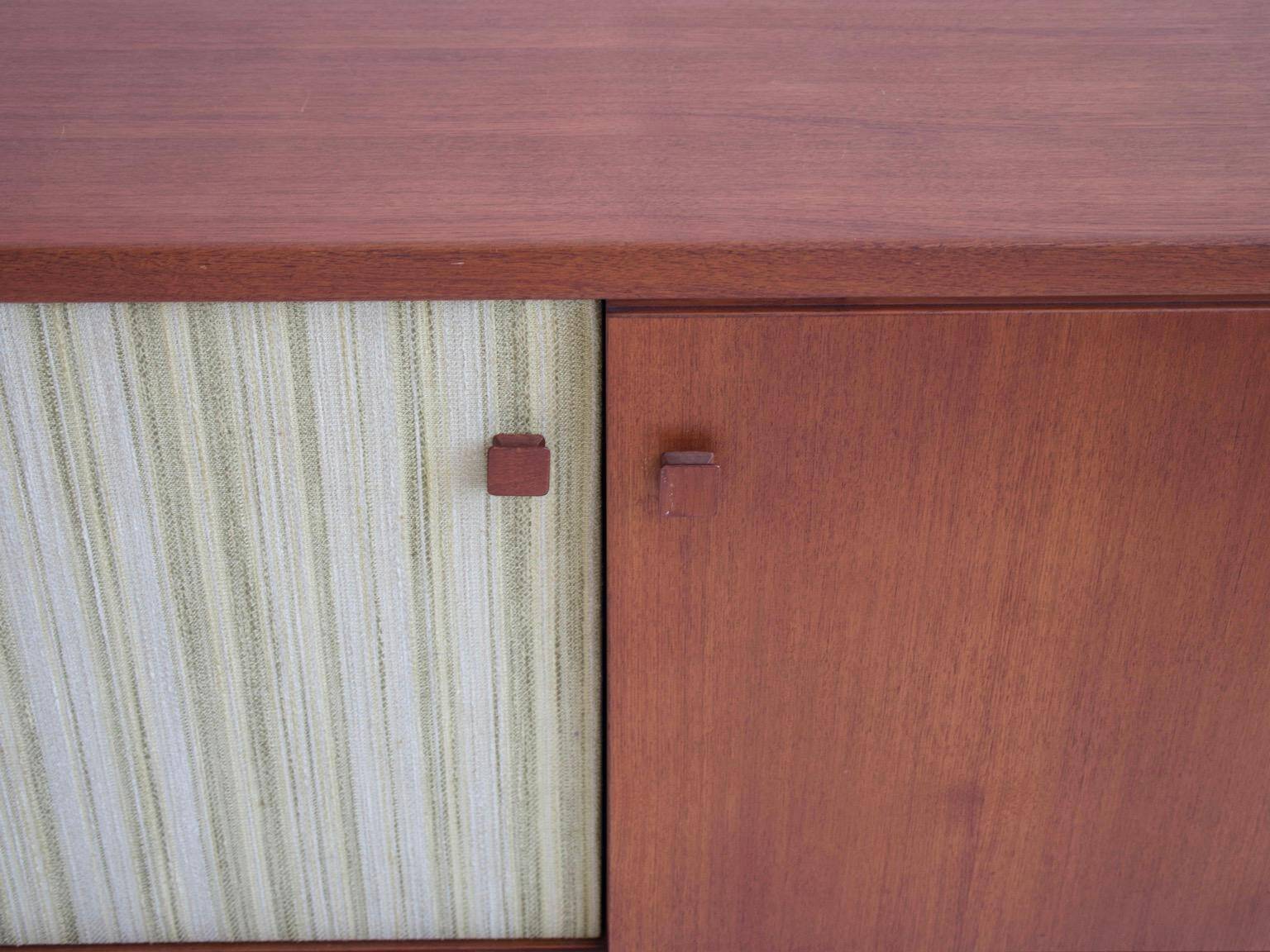 Buffet Ilmari Tapiovaara in teak with fabric and brass details.