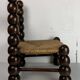 Chaise basse en bois tourné dans le style de Charles Dudouyt, France, années 1950