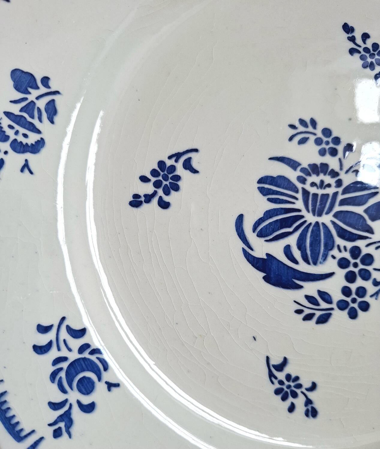 Mismatched antique flat plates accompanied by dishes.
