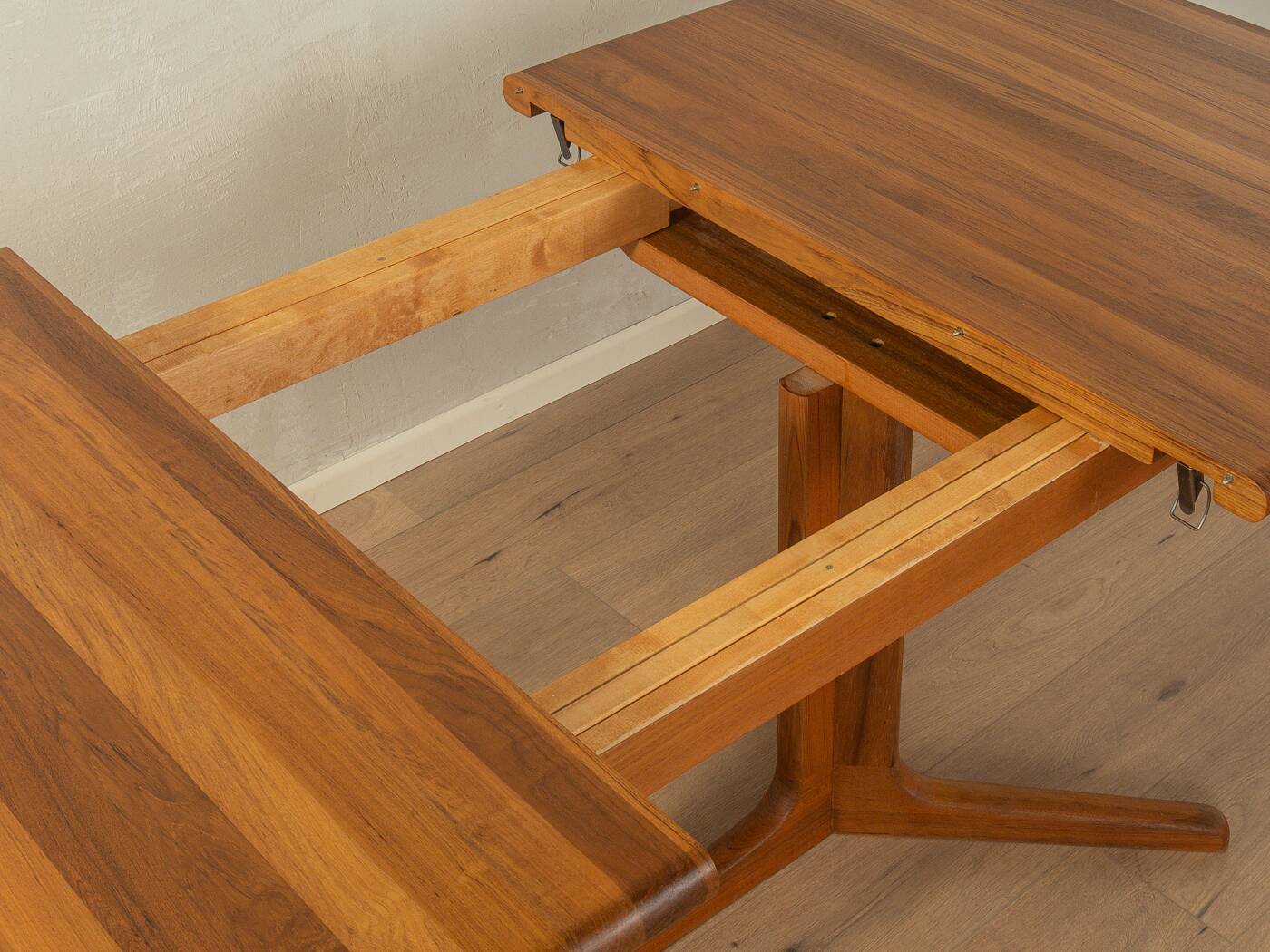 Glostrup dining table, 1980s, solid teak, by Johs. Kristoffersen & Søn, with two extension leaves