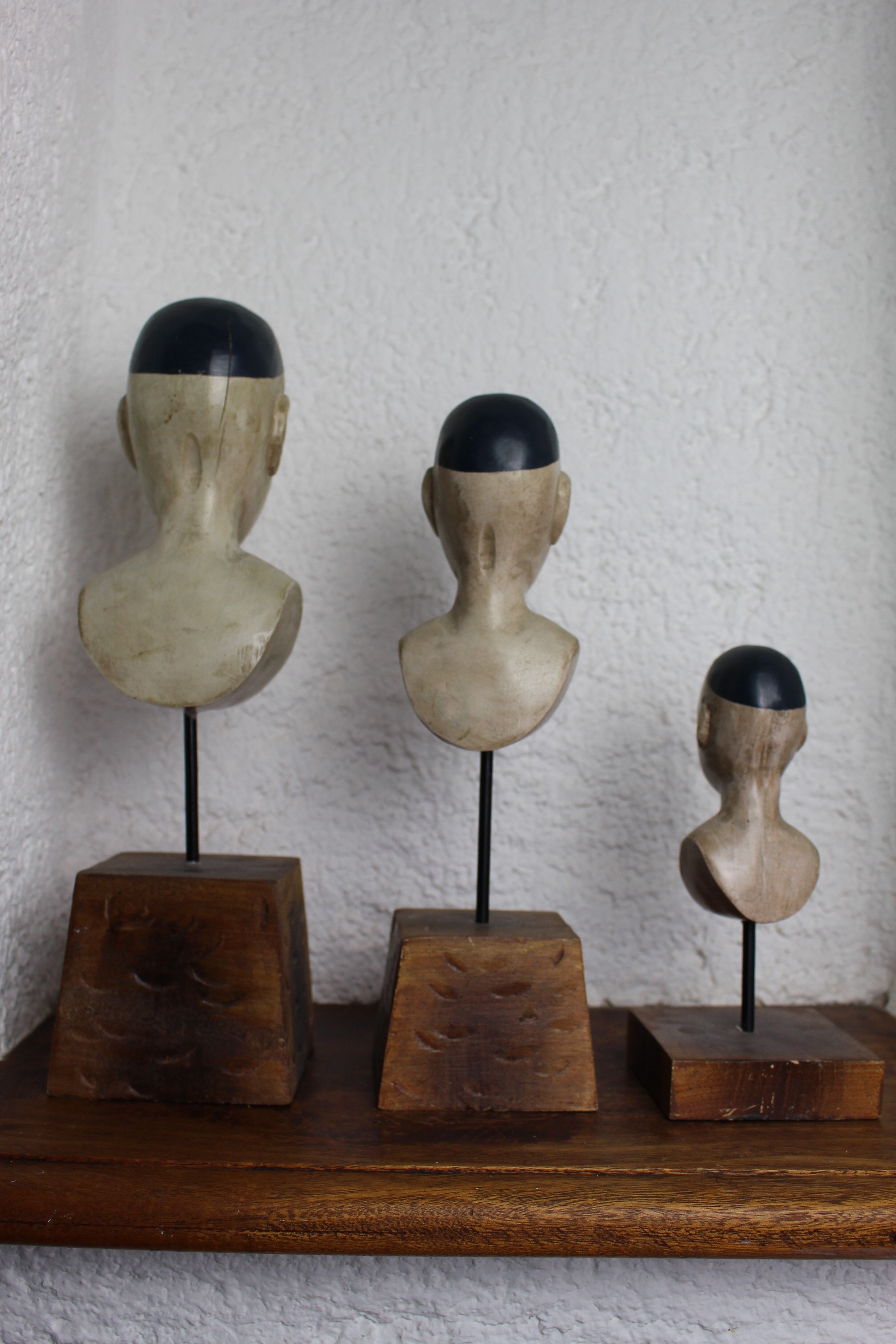 Trio of wooden busts