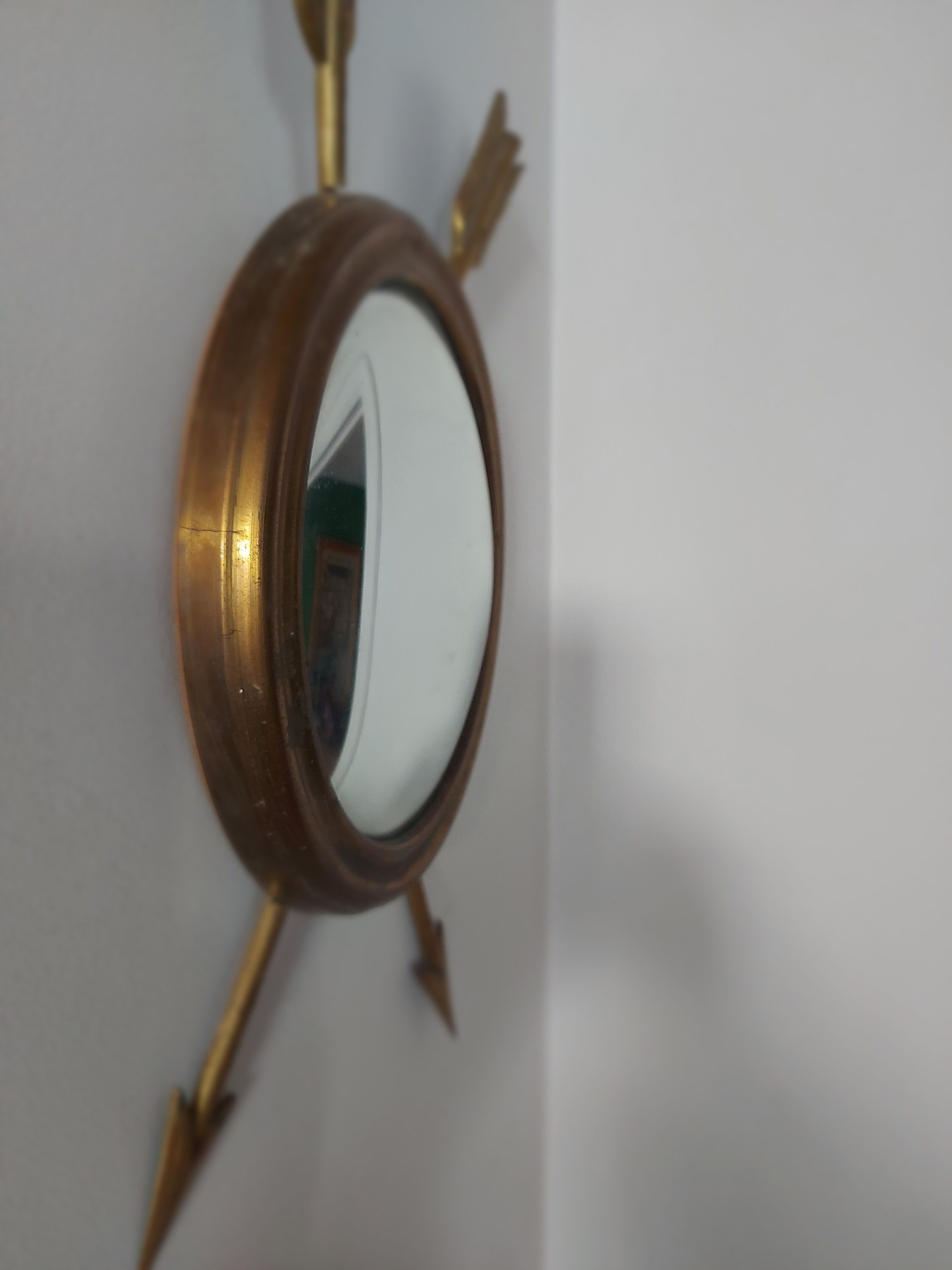 Curved brass witch's mirror