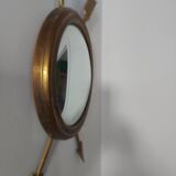 Curved brass witch's mirror