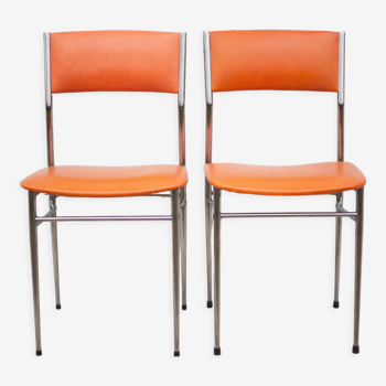 Pair of chrome metal chair and orange skai