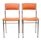 Pair of chrome metal chair and orange skai