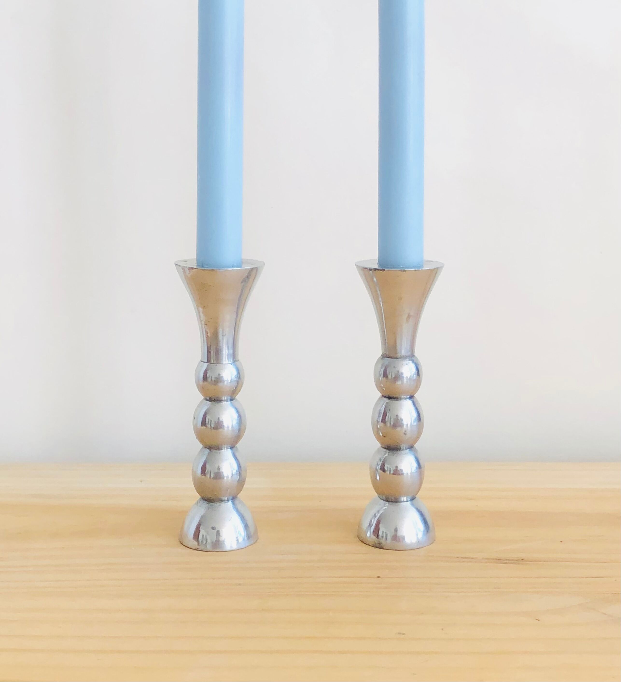 Pair of vintage cast aluminum candle holders