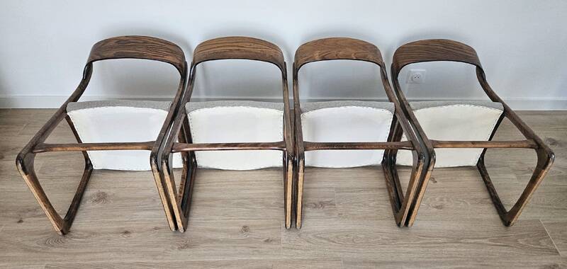 Set of 4 vintage Baumann "Sled" chairs in bent wood.