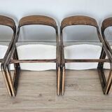 Set of 4 vintage Baumann "Sled" chairs in bent wood.