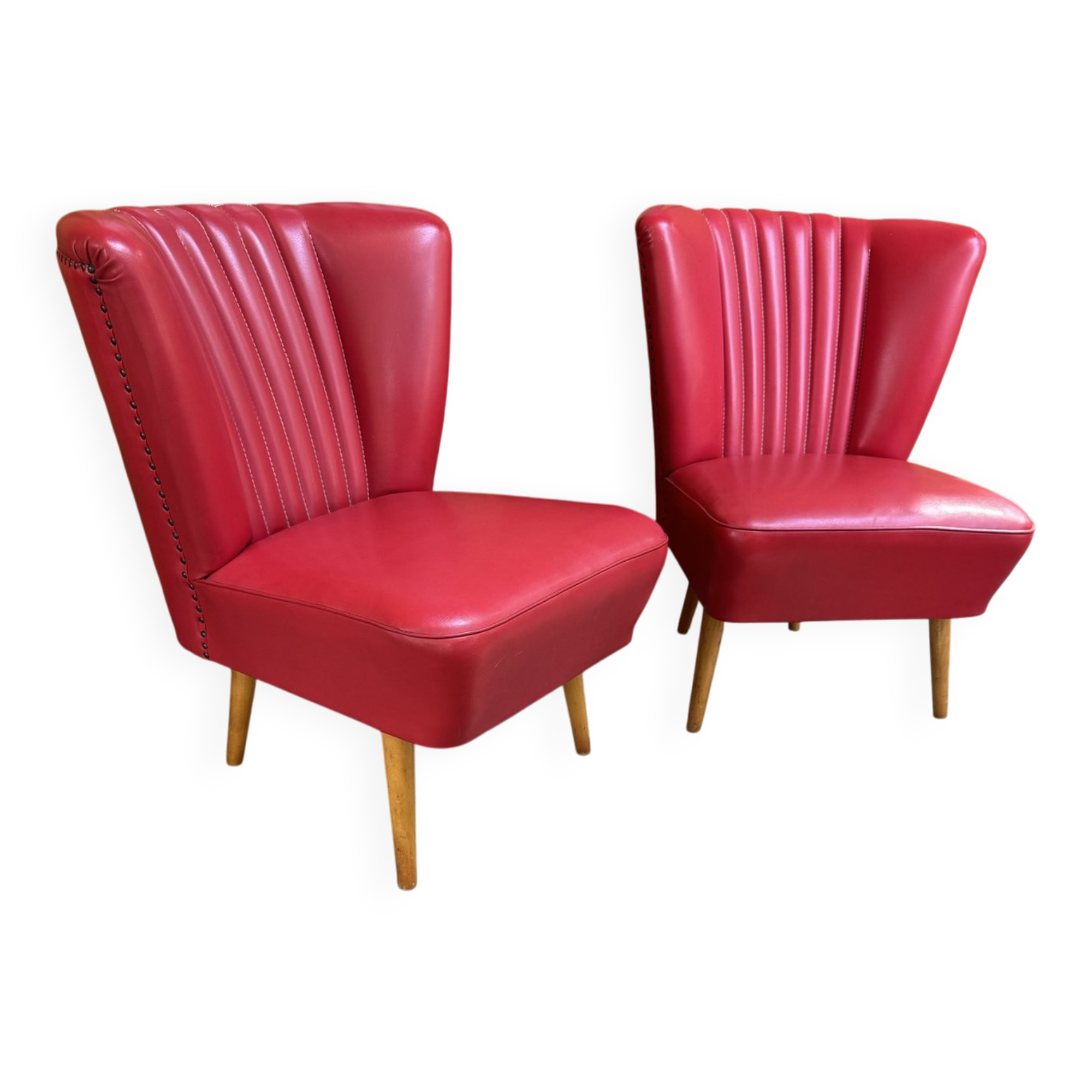 Pair of mid-century cocktail chairs in purple vinyl and beech, 1950s.