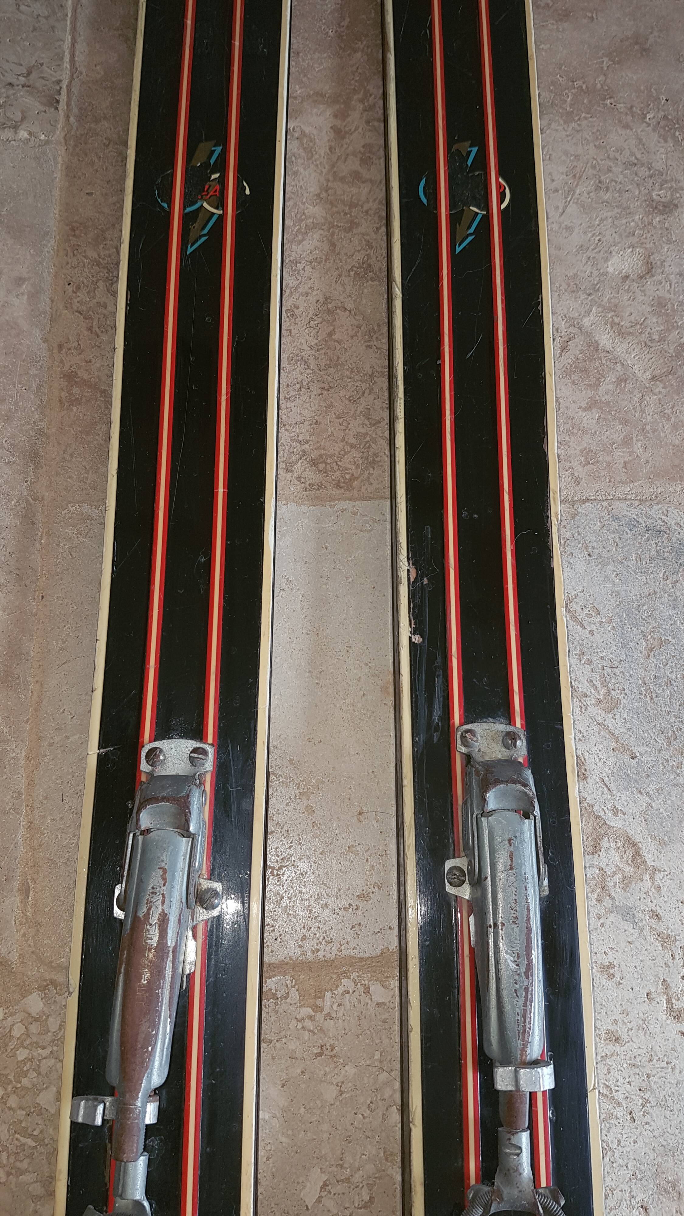 Old skis wooden and its pair of sticks