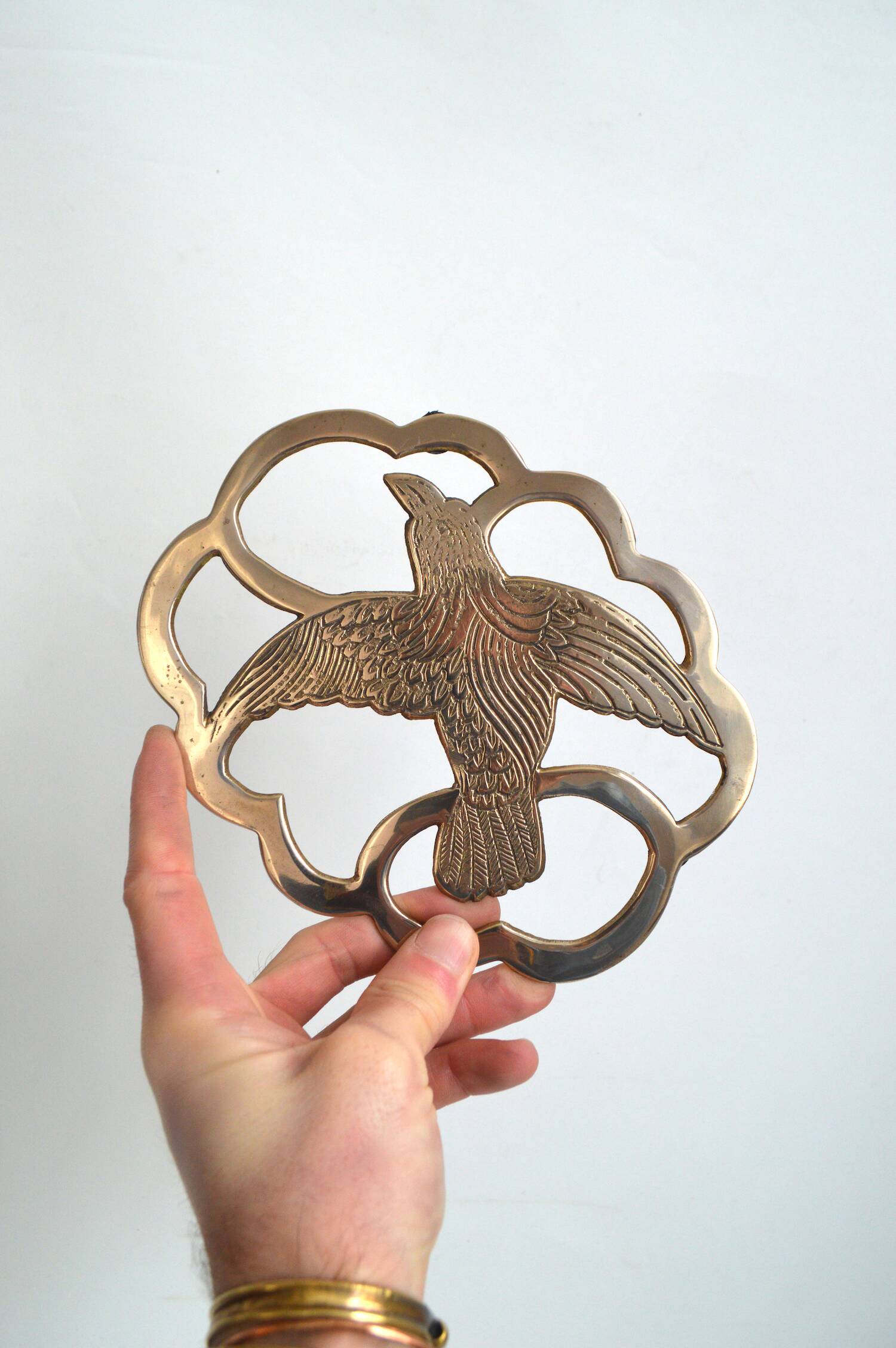 Brass bird trivet
