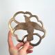 Brass bird trivet