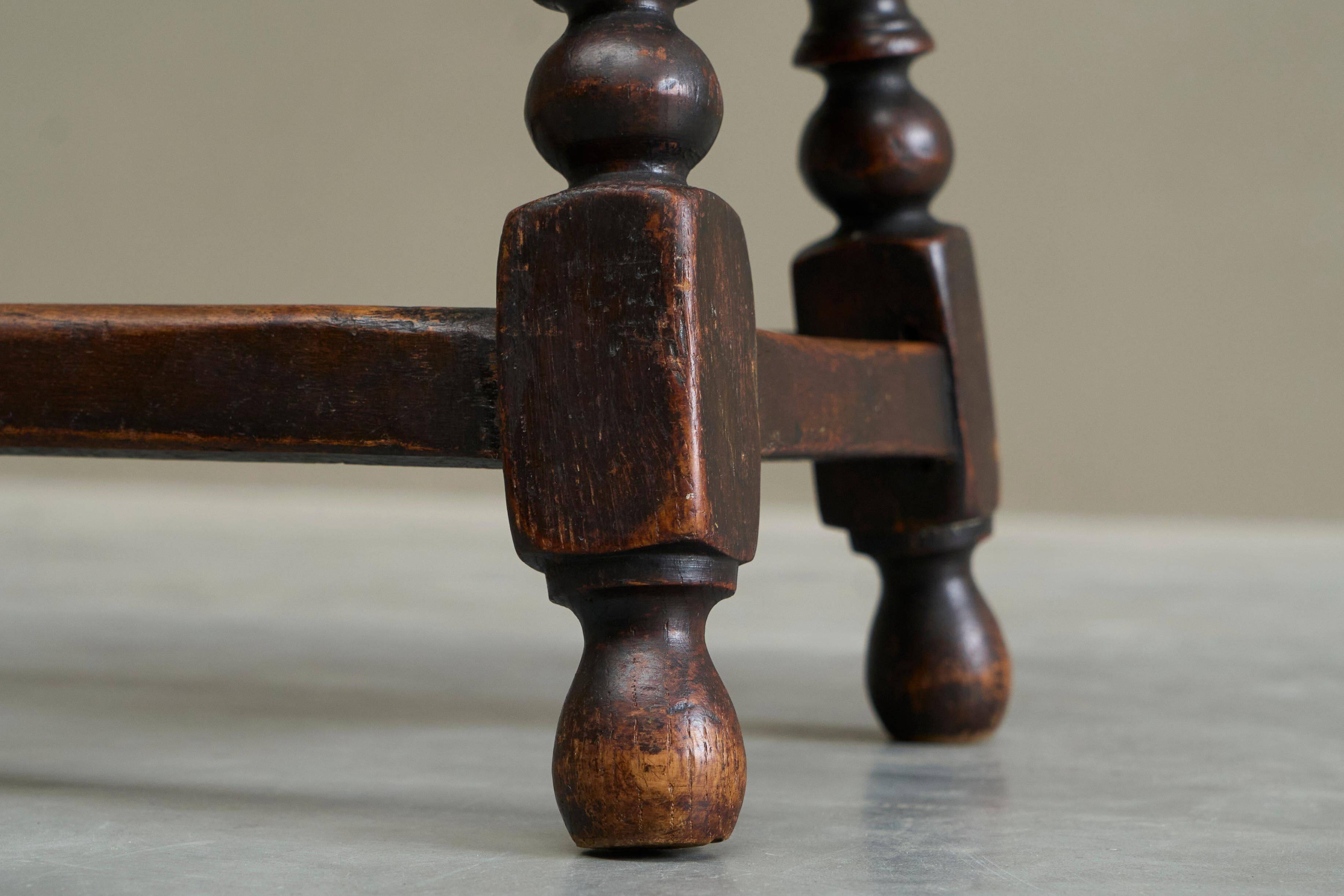 Rustic stool or side table in turned and carved solid oak, 19th century.