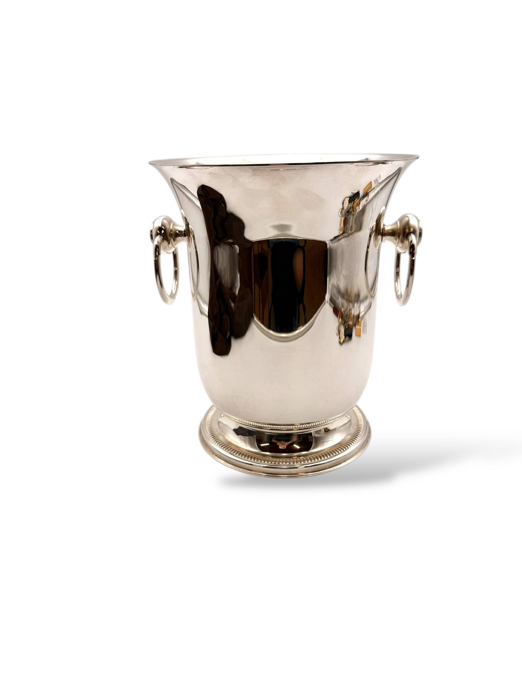 Silver-plated champagne bucket with ring handles.
