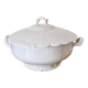 White porcelain soup tureen from Limoges with a vegetal scroll design.