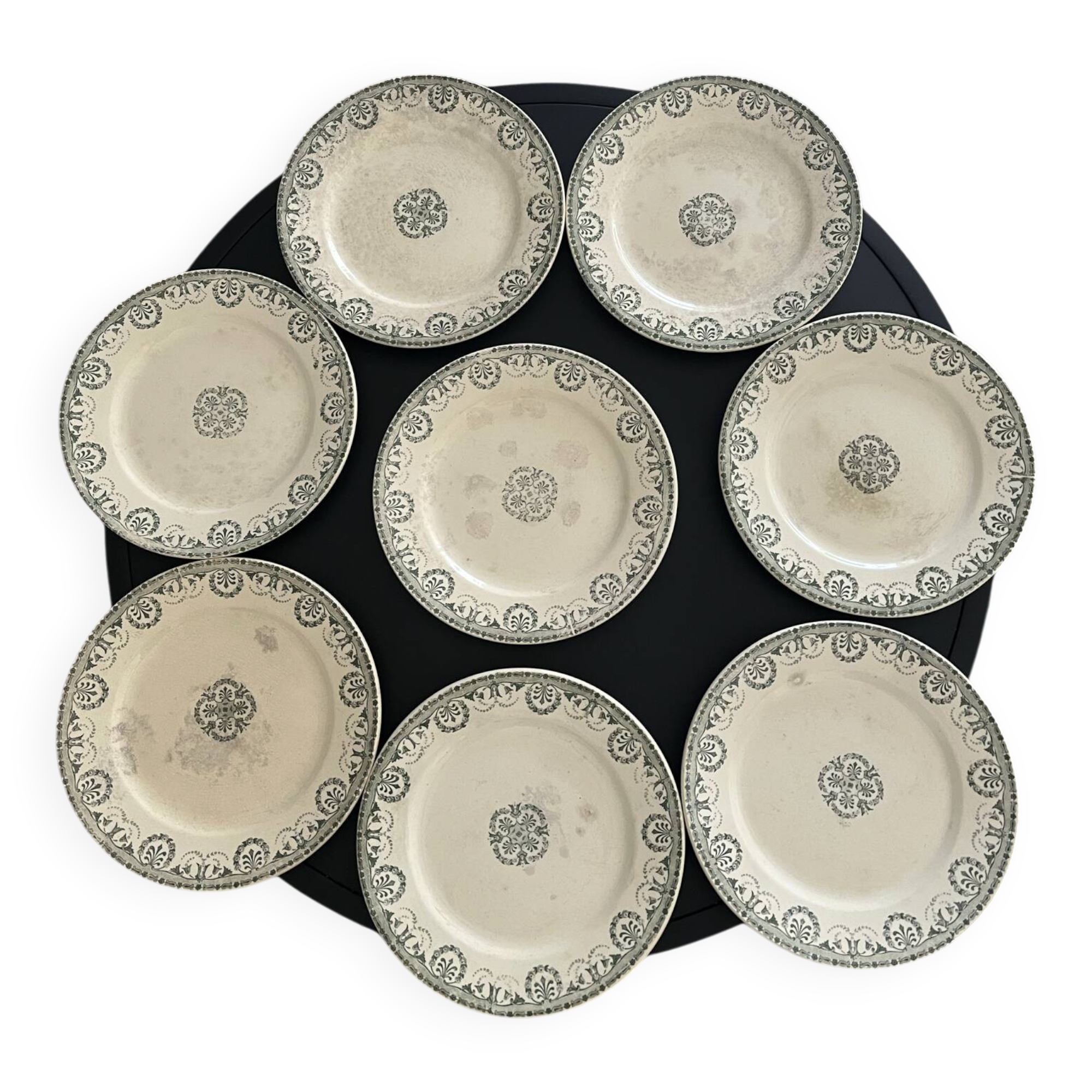 Set of 8 flat plates made of ironstone.