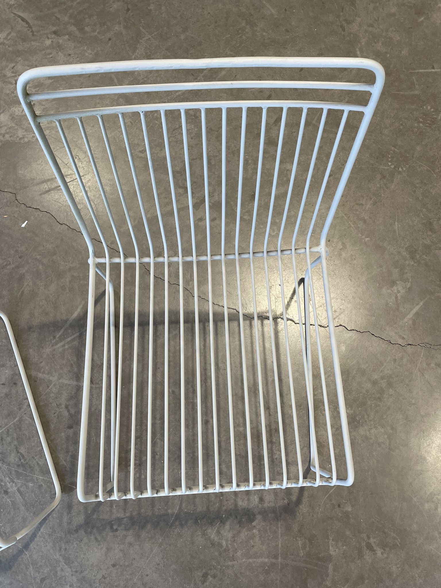 Many handcrafted wrought iron chairs