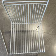 Many handcrafted wrought iron chairs