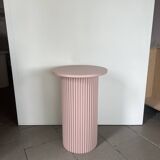 round and fluted bedside table in dusty pink