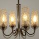French vintage retro chandelier with 4 lights in brass and bronze with cut glass shades.