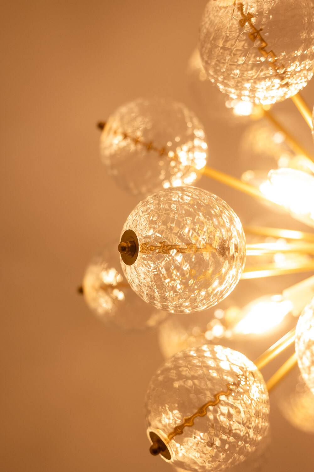 Kamenický Šenov, published by. Brass and glass chandelier. Around 1970.